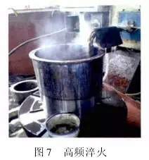 1 引言  山東魯碧建材有限公司2號輥磨為德國進口萊歇磨，主要用于生產礦渣微粉，減速機采用弗蘭德品牌，型號為：KMPP651，其結構為一級傘齒加兩級行星傳動。2013年3月9日，該減速機因功率過高報警，而且潤滑系統回油溫度急劇升高，晚上23：25減速機潤滑站過濾器壓差高報警，整個系統跳停。檢查過濾器濾網時發現有大量的黃色銅屑，經化驗銅屑成分為CuAl10Ni查閱設備圖紙推測該合金來自二級行星輪中的銅瓦。經過咨詢，弗蘭德專家給出了同樣的判斷，并提供了具體的解決方案。隨后， 山東魯碧建材有限公司按照弗蘭德公司出具的方案對該減速機進行了搶修。目前該減速機運行接近兩個月且效果良好。現將具體原因、修復方案及預防措施簡單描述。  2 原因分析  該減速機自2008年2月份開始使用，到現在已運轉5年多，運轉率接近90%，因此設備或多或少存在老化問題，尤其是里面的合金瓦，由于自身硬度較低，一旦潤滑不良很容易造成損傷。在拆檢減速機時發現二級行星有一個行星輪堆積了大量的合金，且無法轉動，證明我們的判斷正確。在對該行星輪拆檢中發現了以下三個問題：（1）兩側的推力瓦嚴重燒蝕熔化（圖1）；（2）銅瓦處存積了大量油泥并將潤滑油道堵塞，而且銅瓦整個開裂、軸向延展接近30mm（圖2）；（3）銷軸局部裂紋（圖3）。    根據以上損壞分析，銅瓦潤滑油孔堵塞之后，造成銅瓦急劇升溫，溫度升高到一定程度使得銅瓦受熱開裂并且膨脹延展，最終與兩側的推力瓦接觸，推力瓦受到擠壓以后迅速升溫最終燒蝕，銷軸因此承受較大的扭矩及高溫，造成裂紋。  3 處理方案  推力瓦、銅瓦、銷軸的方案為按照尺寸重新制作備件。但在檢測齒輪時發現其內孔圓柱度較差以至于變成橢圓，而且表面硬度下降，遠遠低于圖紙要求（HRC55+5）。我們聯系弗蘭德公司欲購買該齒輪，對方回復該齒輪需要德國進口，加工周期為6個月，而且為保證齒輪嚙合，建議6個齒輪一起更換。此時， 山東魯碧建材有限公司銷售正處于旺季，該輥磨每天生產3000t微粉，停機6個月對我們的損失可想而知。我們聯系弗蘭德總部專家要求給出整改方案。對方經過詳細計算給出如下方案：擴大齒輪內孔直徑，再加一個過渡套，從而保證齒輪的硬度及裝配要求（圖5）。    3.1 過渡套材料選擇 過渡套材料采用42CrMo。該材料強度、淬透性高，韌性好，淬火時變形小，高溫時有高的蠕變強度和持久強度，用于制造要求強度更高和調質截面更大的鍛件。  3.2 處理工藝    （1）鍛打：目的是減小殘留夾雜物的尺寸，使其成分趨于均勻，組織趨于致密，細化晶粒，改善鋼的性能。    （2）粗車：單邊留4mm加工余量。    （3）著色探傷：目的是檢查工件是否有損傷，從而保證下一道工序順利進行。    （4）完全退火：目的是使工件的內部組織全部進行重結晶，通過完全退火來細化晶粒，均勻組織，消除內應力，同時降低硬度，便于切削加工，并為加工后零件的淬火作好組織準備（圖6）。    具體過程：零件在爐溫>800℃裝爐，立即通入甲醇：50~60ml/min、氮氣：4~6m3/h；溫度升到850℃之后甲醇：35~45ml/min、氮氣：4m3/h；保溫120min后隨爐冷降溫至650℃，停甲醇，氮氣：5m3/h；降溫至550℃時出爐空冷。    （5）半精車：單邊0.75mm，從而滿足下一步淬火的淬硬層>0.5mm的要求。    （6）高頻淬火（圖7）：該套由于工作面是套的內孔及兩個端面，硬度要求HRC58-62，淬硬層>0.5mm。因此，選擇高頻淬火，這樣既能局部熱處理，同時也滿足硬度要求。另外，高頻淬火時工件的冷卻至關重要，為保險起見采用淬火液進行冷卻；感應器距離工件的位置也非常重要，離得太近容易造成感應器受熱，堵塞冷卻水溢流孔，離得太遠影響熱功率的傳遞，一般控制在3~5mm。       （7）精車外圓及內孔：外圓最終尺寸為?330t6，內孔最終尺寸為?330H6，這樣保證外圓與齒輪內孔過盈配合，過盈量控制在0.2~0.3mm；內孔與銅套間隙配合，間隙控制在0.1~0.12mm。    （8）精車端面：將過渡套與齒輪進行冷裝之后，對過渡套的端面進行精車，要求兩個端面與內孔垂直度，圓跳度誤差控制在0.02mm以內。 目前，該減速機已恢復生產兩個月，二級行星振動值3~5mm/s，輥壓9.0MPa，比表面積440m2/kg，磨機產量也逐漸恢復到150t/h，運轉狀況良好。  4 采取的措施  4.1 加強設備巡檢并采用先進的檢測工具 該減速機恢復生產之后，我們加強了巡檢力度，購買了先進的在線巡檢儀，它不僅能對減速機振動進行檢測形成趨勢圖，而且還能進行數據傳輸及保存，這樣我們就能夠通過趨勢圖來推斷減速機運行狀況。  4.2 加強油品檢測 目前，我們每個月都要對潤滑油進行檢測，項目有粘度、機械雜質、水分、污染等級等，通過對油樣的檢測，可以隨時掌握減速機內部運轉狀況，保證了潤滑的可靠性。  4.3 提高磨機操作水平 喂料粒度控制在80mm以內，這樣既能保證碾磨料層厚度避免磨機振動，又能提高研磨效率；另外，加強選粉機轉速、喂料量、熱風控制的調整，從而保證磨機穩定順行。  4.4 選用材質較好的濾芯 弗蘭德KMPP651減速機內部全部為滑動軸承，對潤滑油的潔凈度要求比較高，一旦有異物進入很容易造成油道堵塞。因此，濾芯的選用至關重要，我們現在選用的是力士樂25μm濾芯，使用效果很好。  5 結語  輥磨的穩定運行對減速機的使用壽命至關重要，減少輥磨運行的振動值，有利于減速機提高使用壽命；另外，定期檢測減速機各個軸瓦部位的振動，并且定期對潤滑油進行檢測及檢查過濾網上有無雜質，對提高減速機的穩定順行也至關重要。